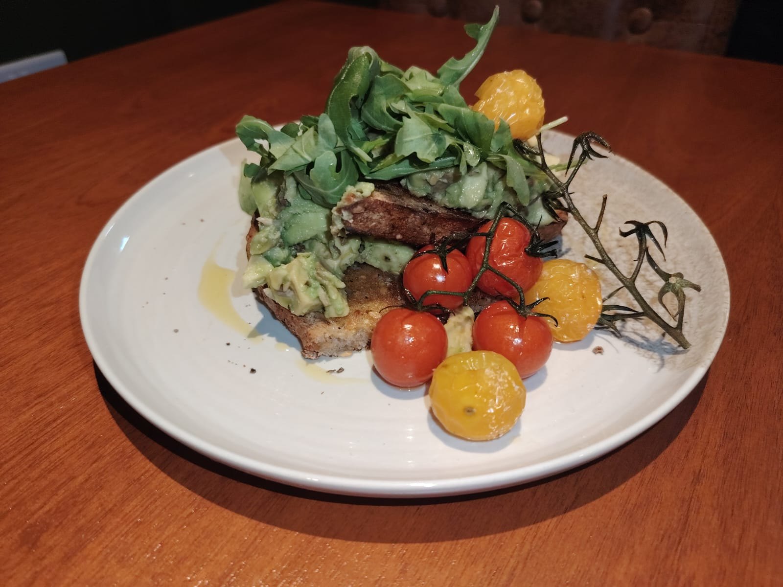 Avocado toast and roasted tomatoes at Cosy Cafe and Kitchen
